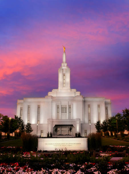 istock Pocatello LDS Mormon Latter-Day Saint Temple at Sunset with Glowing Lights 1567584559
