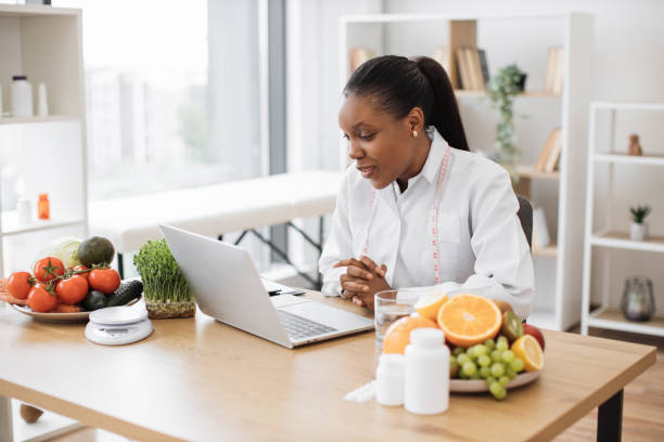 istock Dietitian making video call via device in workplace 1567589858