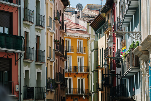 A street with colorful residential buildings in Pamplona old town, Navarra, Spain