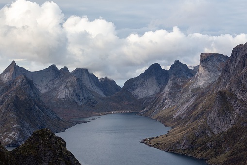 Breathtaking beauty of Lofoten, Norway, as you witness the majestic view from Reinebringen mountain, overlooking the stunning fjord and peaks.