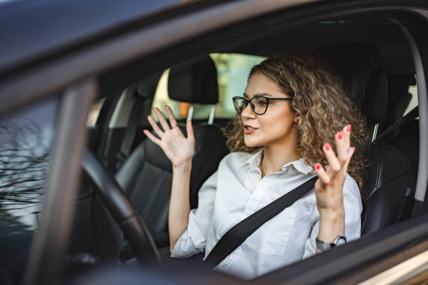 istock Young frustrated female driver looking at traffic 1567628816