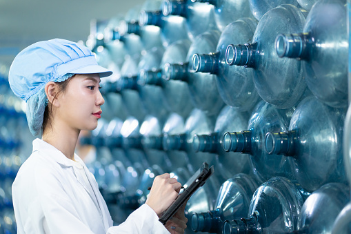 Meet our dedicated Asian scientist-operator, spearheading advancements in the purified drink water factory, providing safe and refreshing hydration to all.