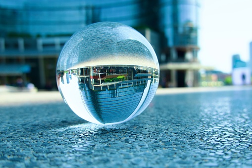 Crystal ball against modern building