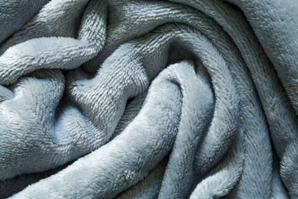 Gray towel background,Gray towel texture.Terry towel background.Soft bath towel authentic texture