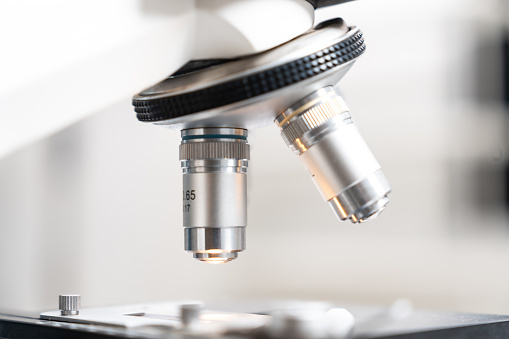 Closeup of Scientific microscope data analysis in the laboratory, medicine equipment research setting in lab for chemistry analysis