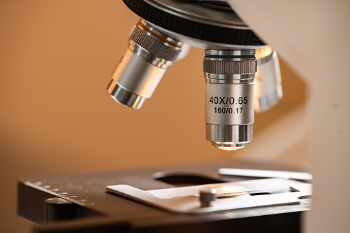 Closeup of Scientific microscope data analysis in the laboratory, medicine equipment research setting in lab for chemistry analysis