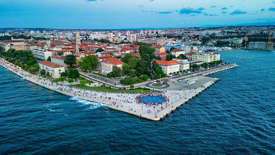 Zadar at sunset, Croatia. Aerial view of promenade with sea organ and greeting to the sun landmarks