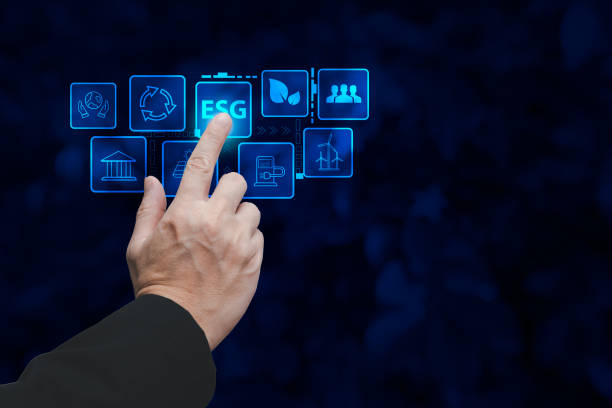 istock hand touch hologram to save energy,and reduce world warming,climate change,ecology friendly investment,ESG environment social governance,Green Business Innovation and Sustainable Development concept. 1567725014