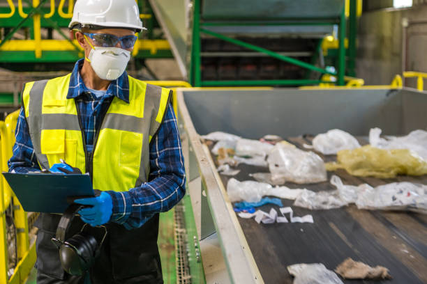 Waste Management Sorting Facility Worker stock photo