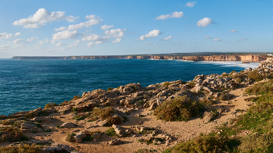 Panoramic view of the western coastline of the Algarve region in Portugal. Praia do Tonel and Cabo de Sao Vicente in the background