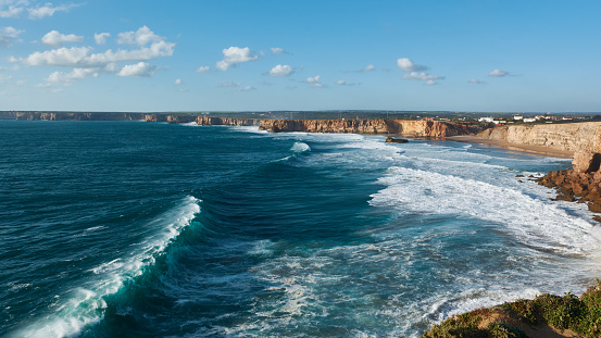 Beautiful view of the western Portuguese shore. Stormy Atlantic Ocean with giant waves.