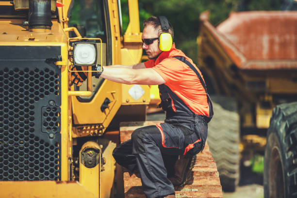 istock Professional Heavy Duty Machine Mechanic Performing Bulldozer Check 1567744324