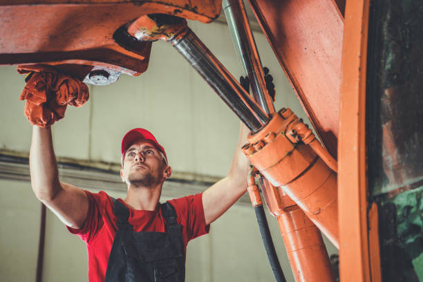 Heavy Equipment Mechanic Performing Excavator Maintenance