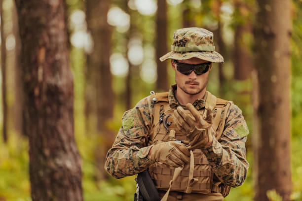 istock American marine corps special operations soldier preparing tactical and commpunication gear for action battle closeup 1567755576
