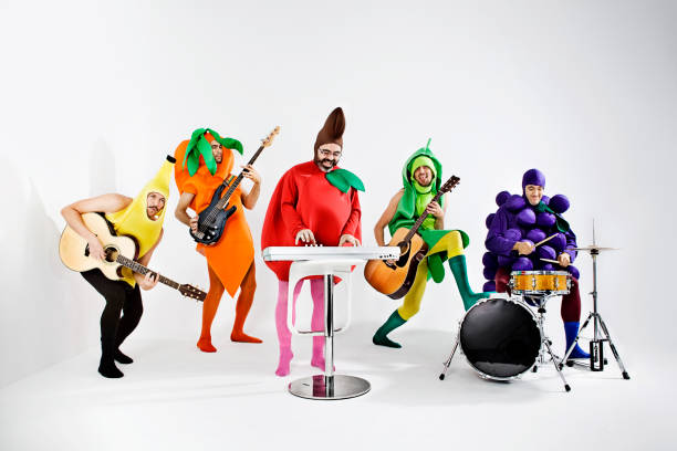 Vegetables Rock band Rock band dressed up as vegetable stage costume stock pictures, royalty-free photos & images