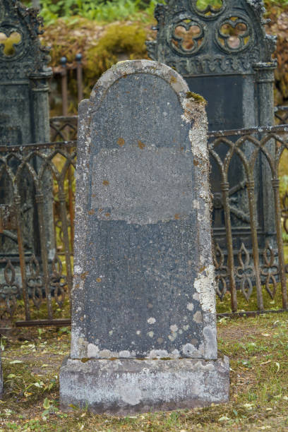 istock Old empty stone cross in ancient cemetery. 1567767994