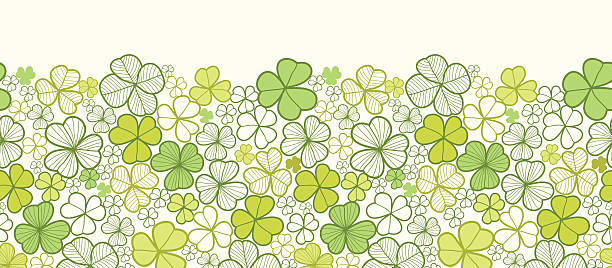 Clover Horizontal Seamless Pattern Border Vector horizontal seamless pattern ornament with hand drawn ornate clover plants in the shades of green. pics for shamrocks to print stock illustrations