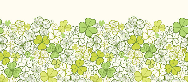 Clover Horizontal Seamless Pattern Border Vector horizontal seamless pattern ornament with hand drawn ornate clover plants in the shades of green. irish shamrock clip art stock illustrations