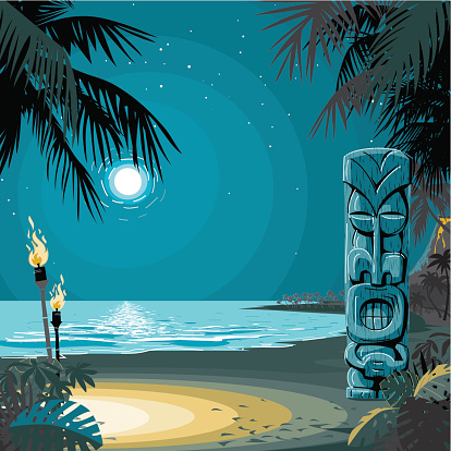 Tiki totem on a desert beach by the moonlight.