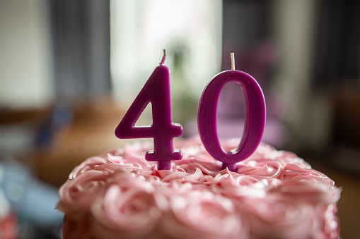 birthday cake on wooden table on light background