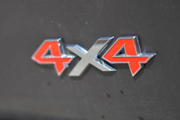 istock Red number four surrounded with a chrome, silver border and a silver x symbolising 4 by 4 4x4 1567821629