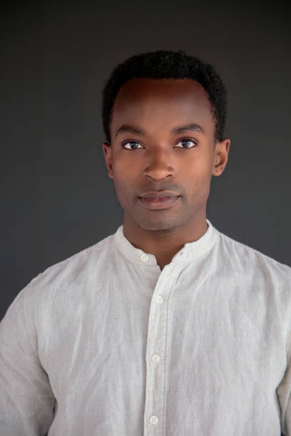 istock african man portrait studio head shot white shirt 1567825047