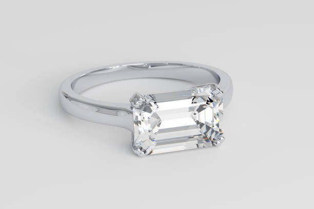 Close-up view of diamond ring with emerald cut stone