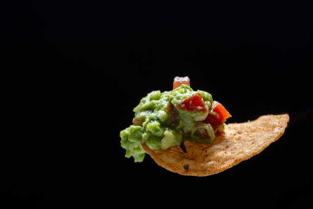 istock Delicious nacho chip with guacamole 1567873299