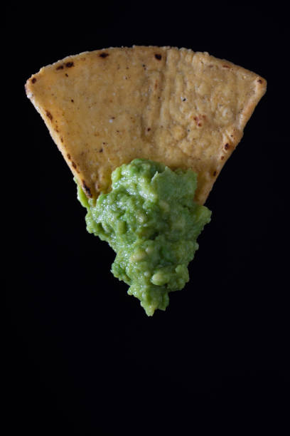 istock Delicious nacho chip with guacamole 1567873300
