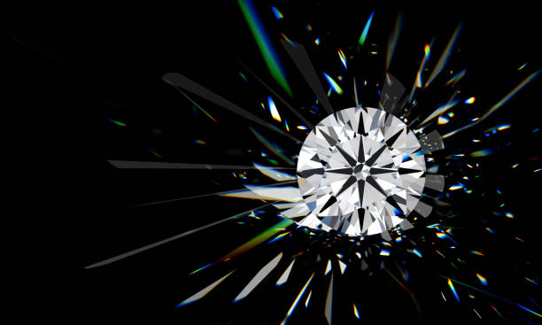 istock Round brilliant diamond with colorful rays of refracted light on black background 1567876509