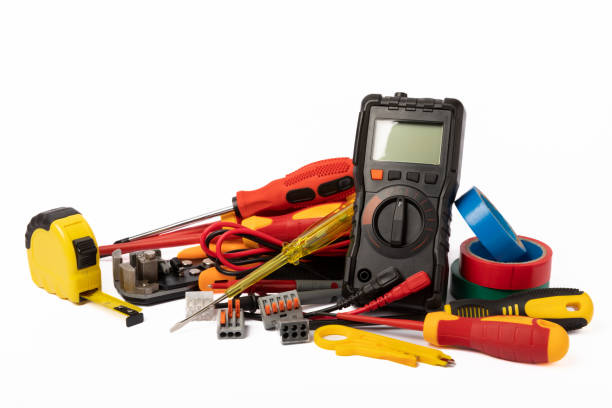 istock Electrician tools isolated on white background.Electrician tools set. Multimeter, construction tape, electrical tape, screwdrivers, pliers, LED lamp, socket, switch and automatic insulation stripper. 1567879338