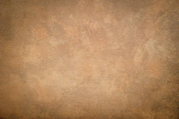 istock Brown rough wall texture, Cement background, brown painted wall texture or background. rough cement wall. 1567900588