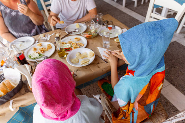 istock Happy Family Dining Out Together 1567908203