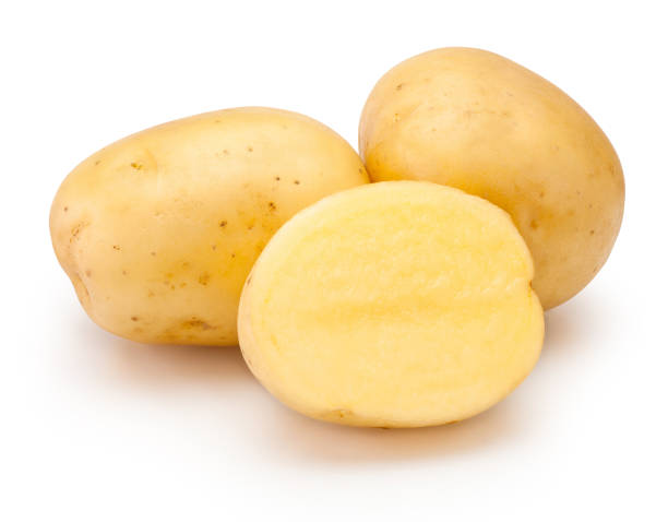 istock Raw potatoes freshly cut in half isolated on white background 1567930103