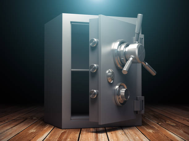 istock Open bank vault safe on black background. Security and protection. 1567932819