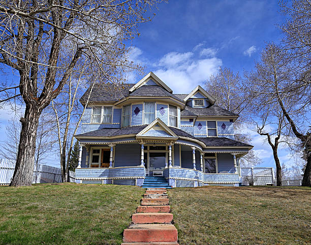 Old Victorian blue house Adorable, well kept Victorian house. colonial style photos stock pictures, royalty-free photos & images