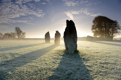 Stones at Avebury in misty morning , England