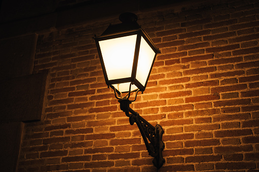 Close up photo of old vintage lamp outdoors during night time.