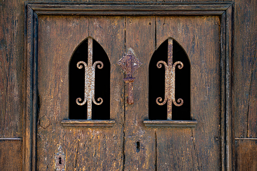 Medieval wooden door weathered in Hondarribia village, Gipuzkoa, Guipuzcoa at Basque Country of Spain, Euskadi