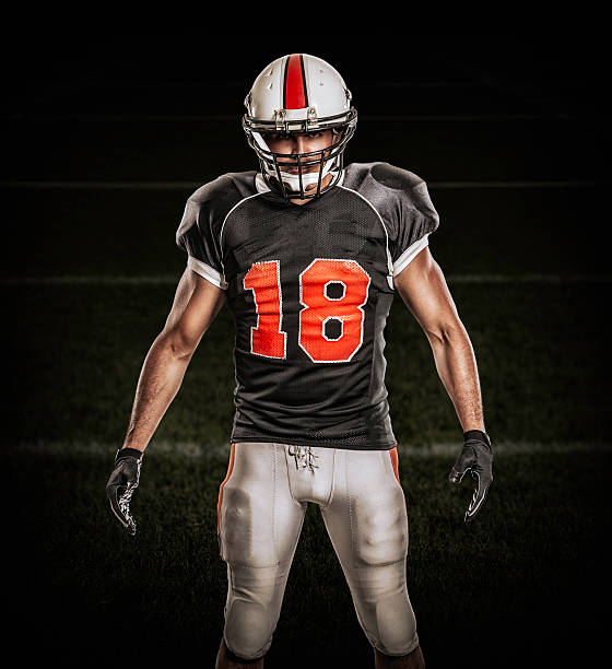 istock American football player in black uniform 156795462