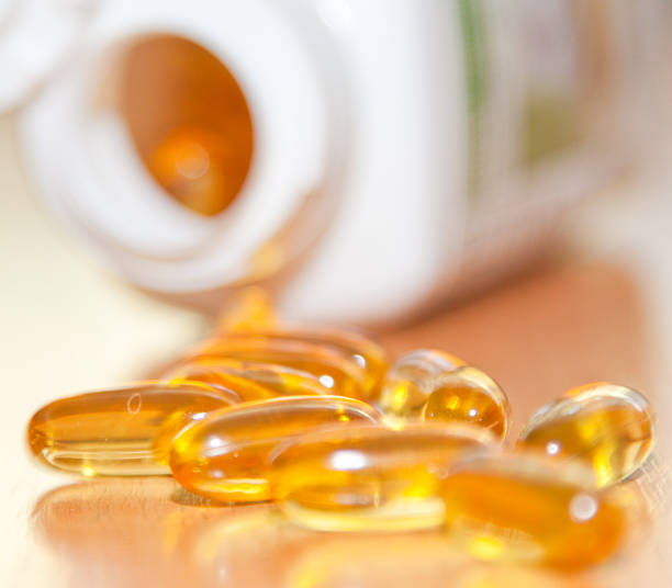 cod liver oil - - capsule gel effect pill vitamin pill stock-fotos und bilder