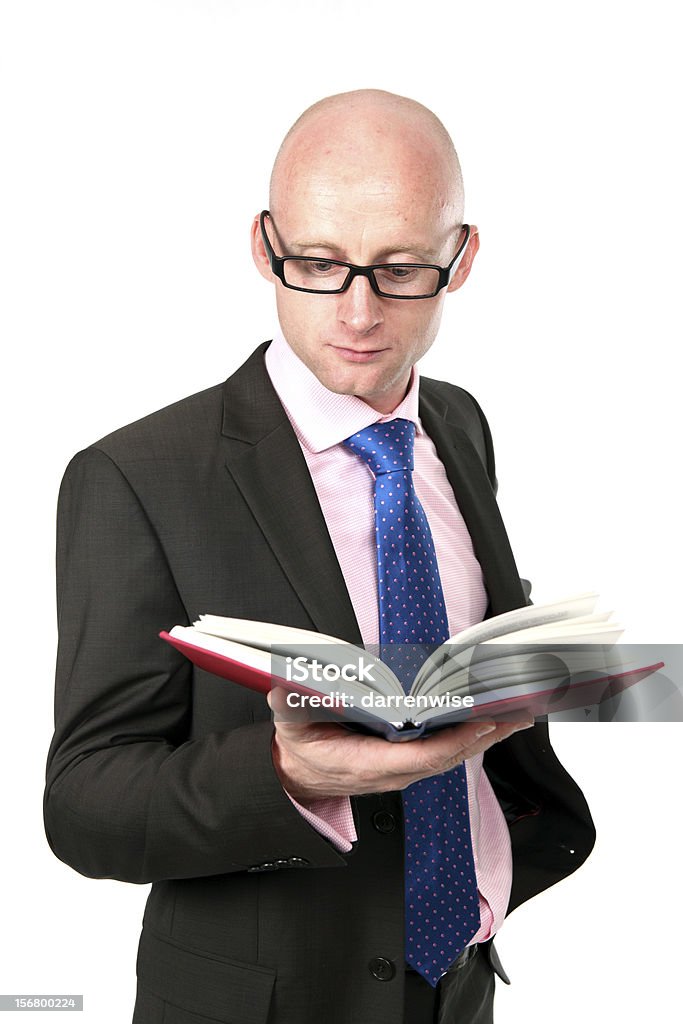academic An academic with a book and glasses. Adult Stock Photo