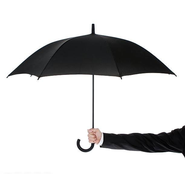 Open umbrella in hand Human hand holding an umbrella isolated on white background domestic staff stock pictures, royalty-free photos & images