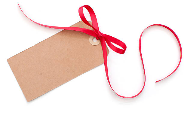 istock Brown blank gift tag with red ribbon on white background 156803055