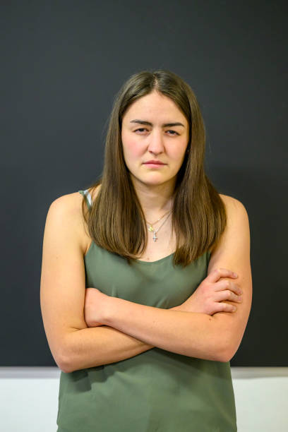 istock Angry teacher standing at the blackboard 1568048696