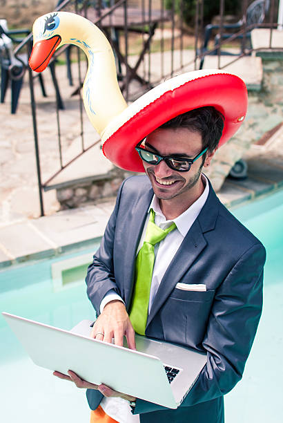 istock Young business man holding pc with a lifepreserver in head 156805191