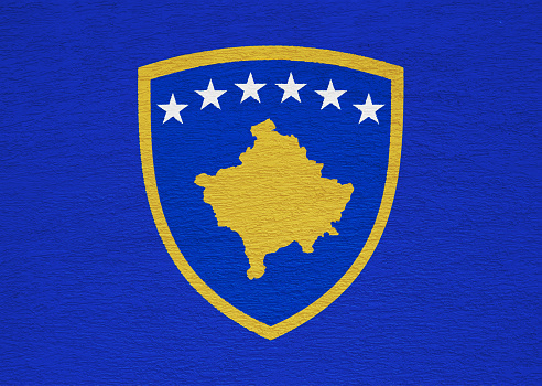 Flag and coat of arms of Republic of Kosovo on a textured background. Concept collage.