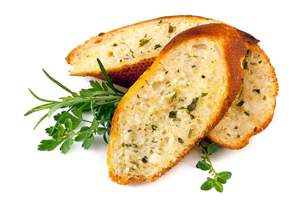 Garlic bread with herbs, isolated on white.