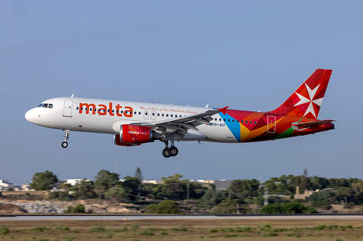 Luqa, Malta - July 24, 2023: Air Malta Airbus A320-214 (Reg: 9H-AEP) landing runway 31.