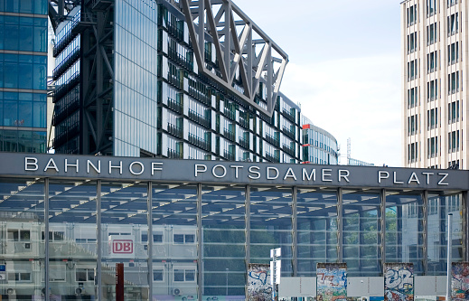 Toronto, Canada - August 26, 2021: Colorful signs dominate Yonge-Dundas Square downtown. Small fountains spurt water around the popular outdoor venue on a summer morning.\n1 Dundas Street East.